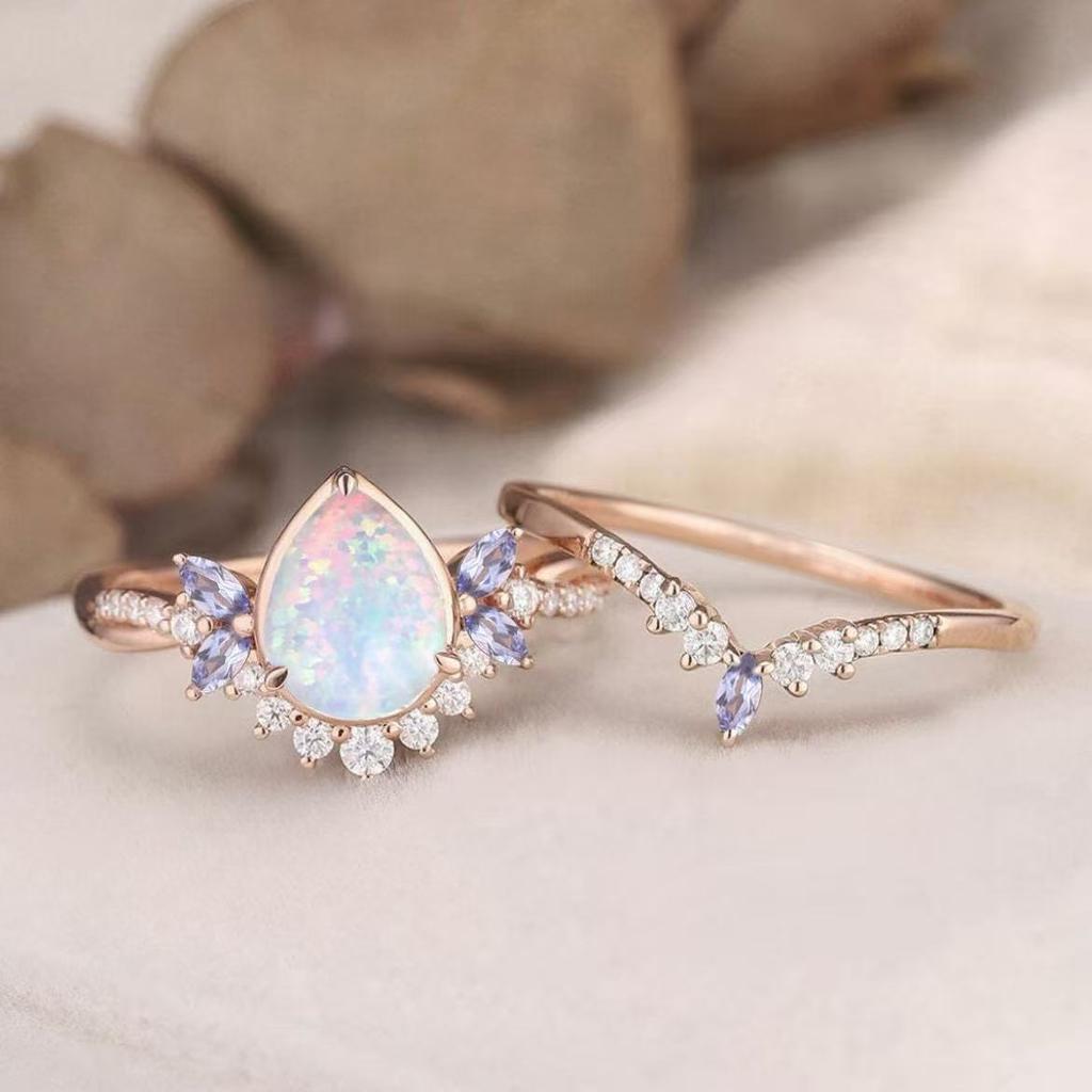 New European and American rose gold pair of rings with water drop opal stones Bow-shaped couple rings for women