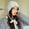 Angola rabbit fur knitted hat for women, lace-up bag head hat in autumn and winter, wool thermal ear protection hat shows a small tide