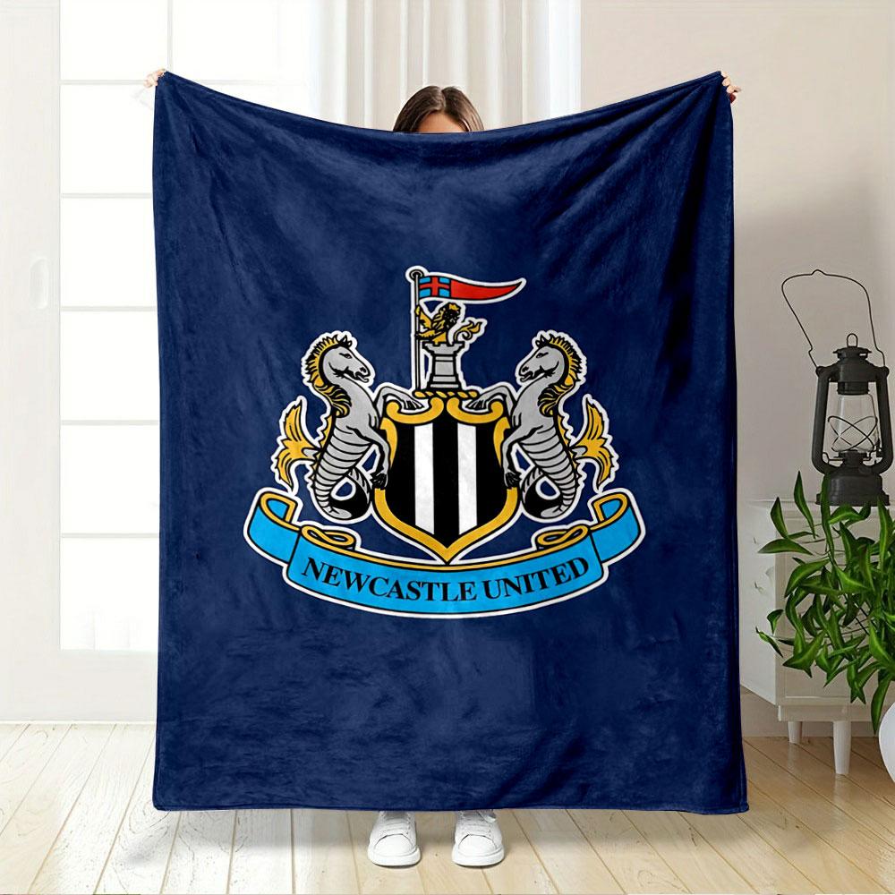 A shield with black and white stripes, flanked by seahorses, and a banner. for all seasons blanket lunch break throw gift