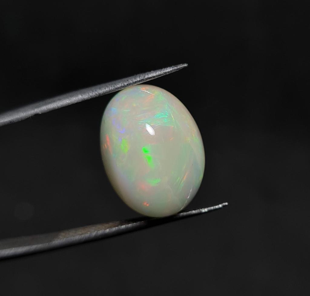 Естественная свободная драгоценная камень кабошон эфиопского опала размер 4,55 карата 14кс11кс6 ММ