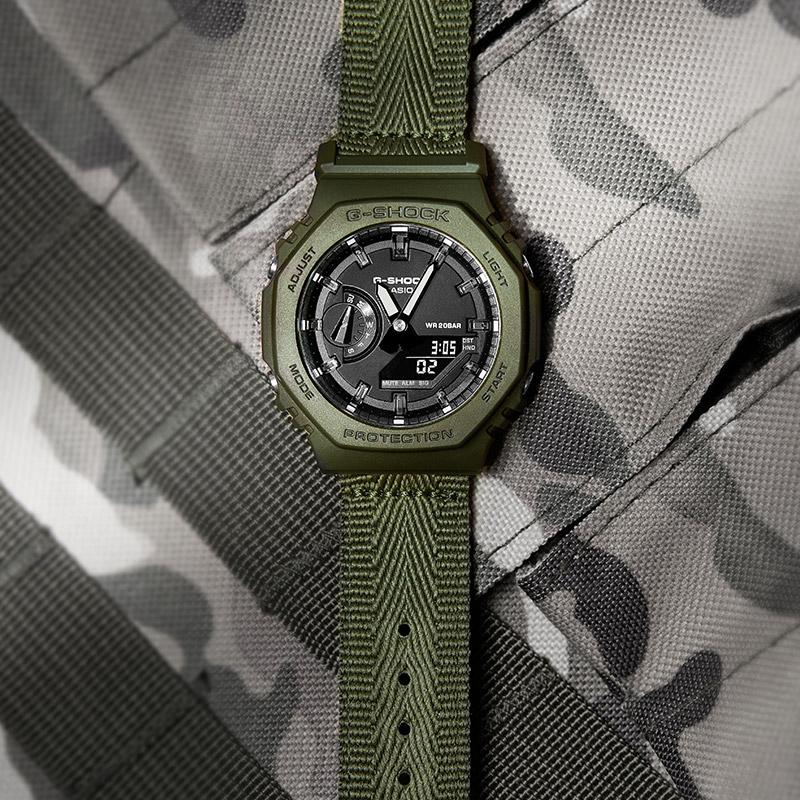 Casio Серия «Снежный камуфляж» Сменный ремешок Водонепроницаемые и ударопрочные Спортивные часы Кварцевый механизм Пластиковый ремешок Японские и GAE-2100GC-7APR