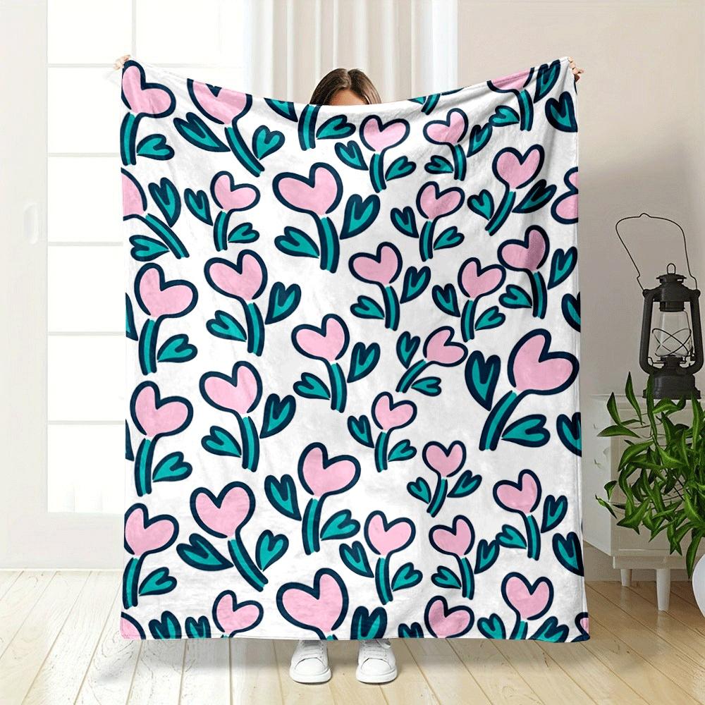 Pink heart-shaped flowers with teal leaves on a white background. for all seasons blanket lunch break throw gift