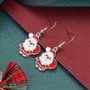 Festive earrings with Santa Claus with sack in white and red
