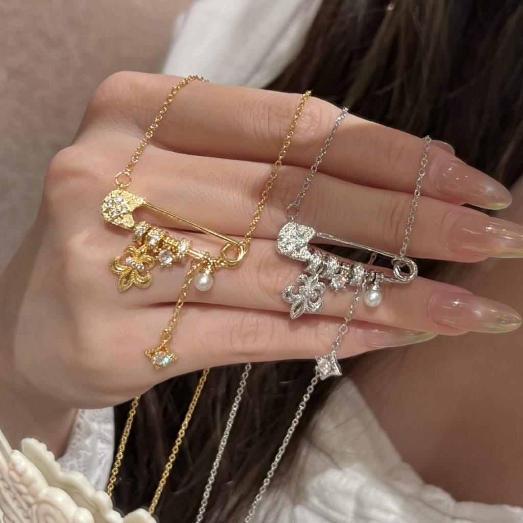 New popular brushed iris flower starburst pearl brooch necklace for women, light luxury niche design pendant accessory, collarbone chain