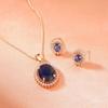 Round Designer Pendant With Zircons And Blue Stones Rose Gold Plated For Women