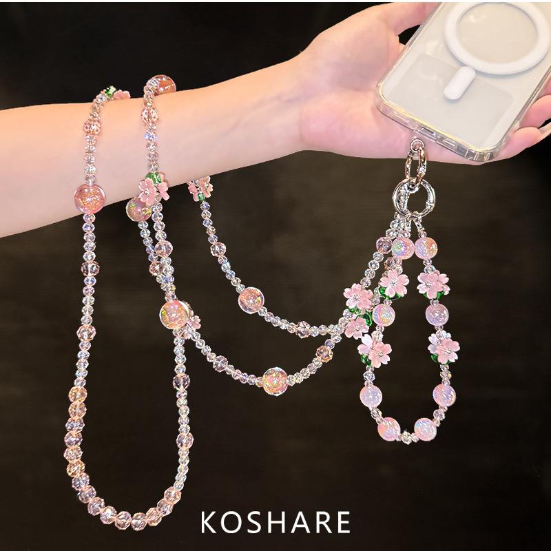 Peach blossom flash messenger mobile phone chain light luxury high-end crystal hanging chain fashionable anti-drop hand carry pendant female beads