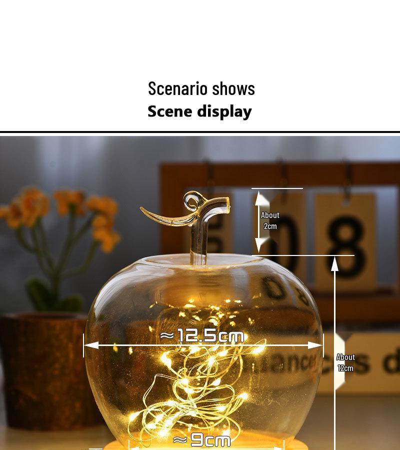 Купол из стекла с изображением вареных яблок и цветов, украшенный глиняной поделкой, для украшения рождественского стола.
