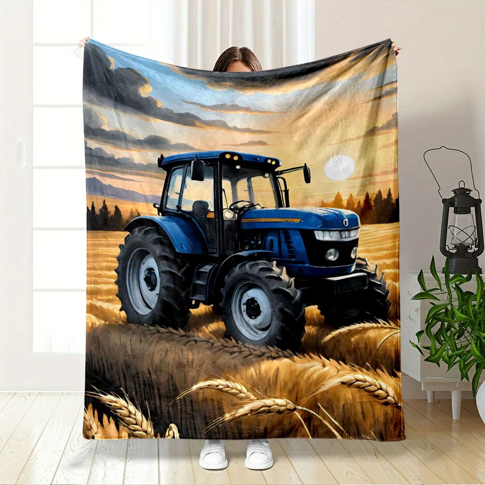 A blue tractor in golden wheat fields under a sunset sky with clouds. for all seasons blanket lunch break throw gift