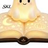 Ghost Figurine Desk Lamp Magic Book Night Light, Resin Tabletop Warm Glow with Moon Cute Light Star Relief, Bedside Sleeping for Kids Bedroom,
