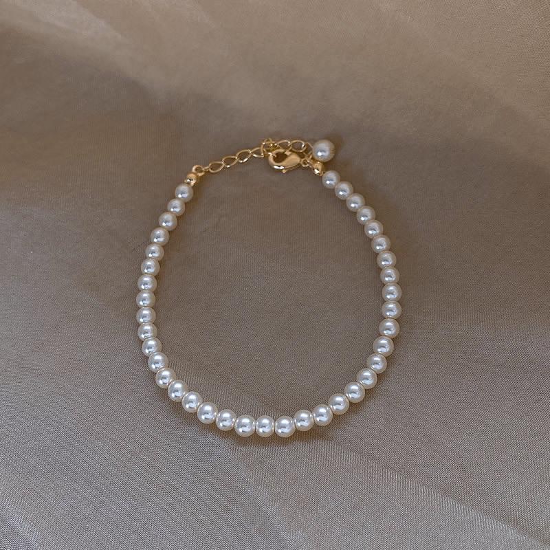 Элегантный браслет из стеклянного жемчуга: Простой многослойный дизайн с имитацией хрустальных жемчужин Шицзя для теплого, мягкого и женственного оттенка