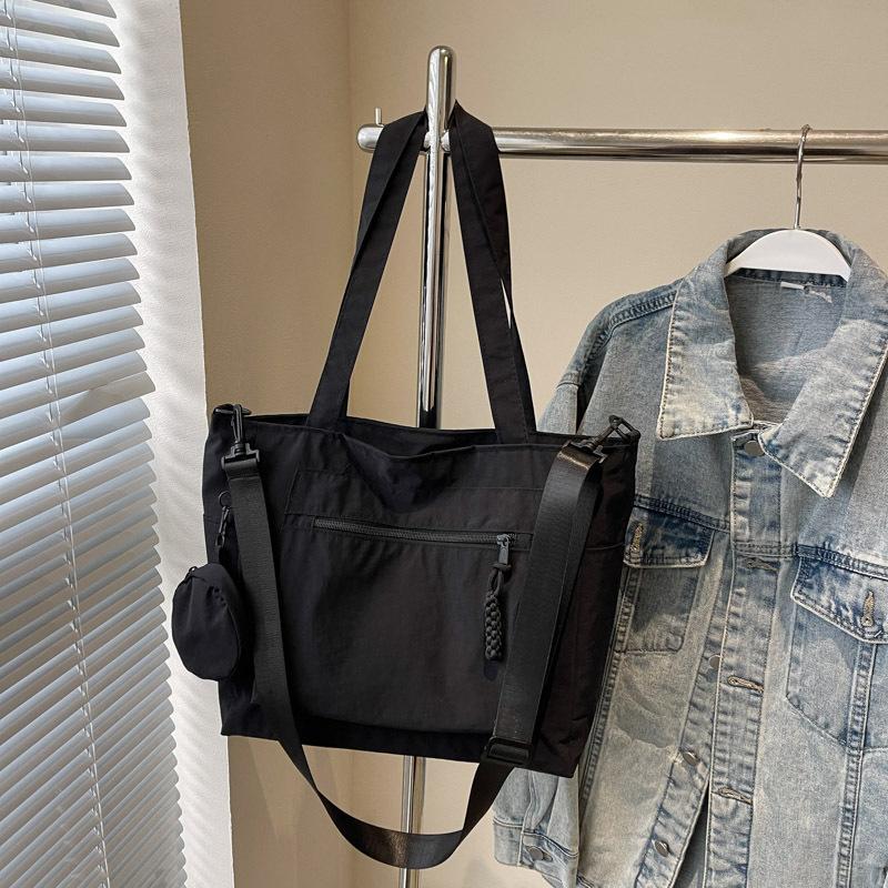 Красивая сумка-тоут, женская, трендовая, портативная, на плечо, 2025 новая, простая однотонная, большой вместимости, сумка-мессенджер