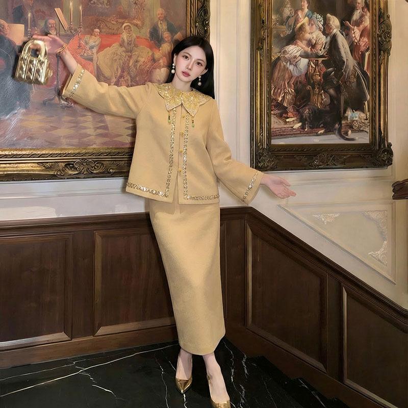Autumn and winter national style new Chinese temperament heavy industry embroidery design jacket + cloud shoulder skirt two-piece set female NZ111