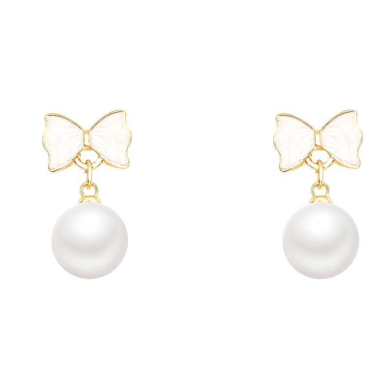 Серьги-бантики из серебра 925 пробы с жемчугом — модный, элегантный, универсальный дизайн