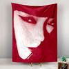 High-contrast close-up of a face with bold eyeliner and red tones. Patterned tapestry for bedroom and living room home decor