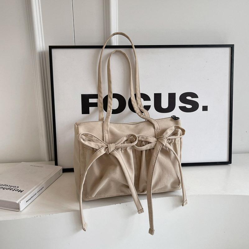 Новая сумка-тоут с бантом, высококлассная, вместительная сумка на плечо, женская простая однотонная сумка для通勤, сумка под мышкой