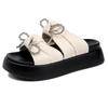 Sweet slippers women's outer wear summer new fashion thick-bottomed beach one-word bow flat-bottomed sandals