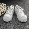 Высококачественный нишевый бренд Натуральная кожа Сплошные белые плоские кроссовки для мужчин женщин подростков пары Платье Обувь для увеличения роста