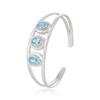 Blue Topaz Cuff Bracelet: Oval Gemstone, Sterling Silver