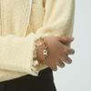NEUF PIECE GATE SYMBOL BRACELET / GOLD