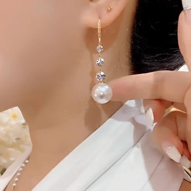 Элегантные серьги-подвески с жемчугом: Универсальный и Стройнящий для Женщин - Тренд 2025.