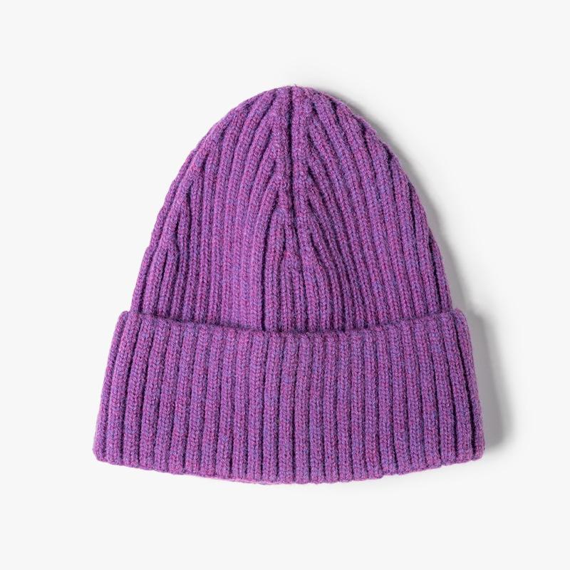Fashion jacquard knitted hat women's autumn and winter outdoor warmth brimless pointed hat thickened ear protector wool hat tapered hat