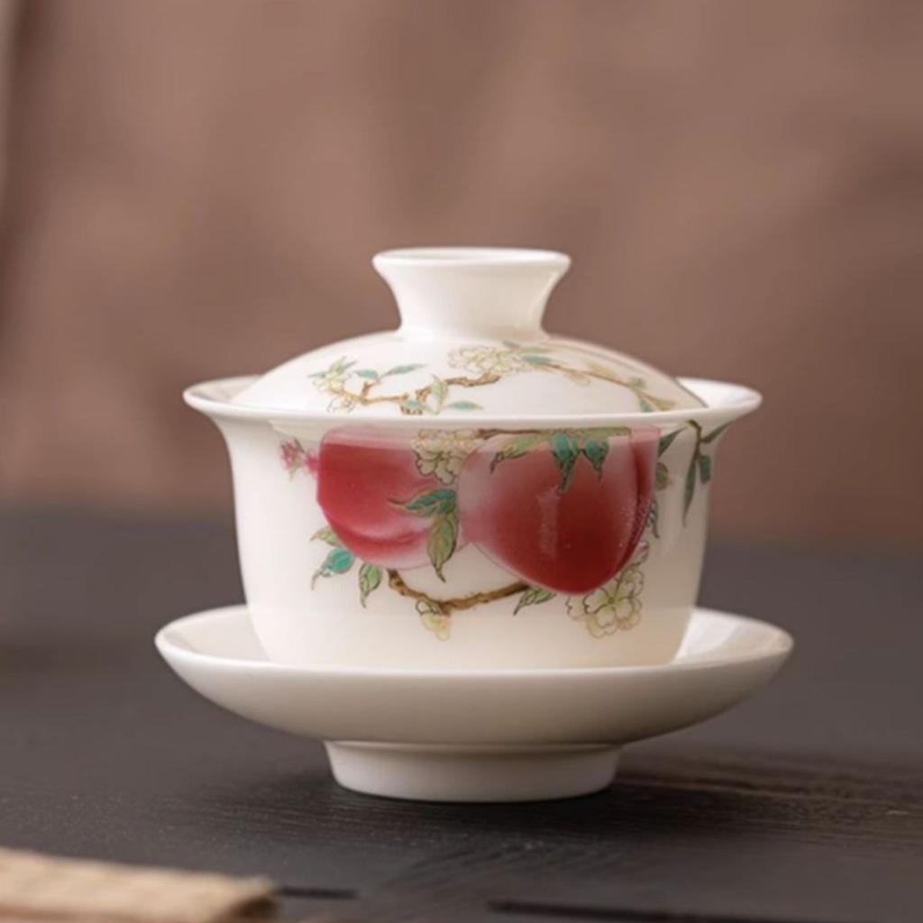 Dehua white porcelain three talents cover bowl teacup suet jade kung fu tea set, a single high-grade longevity peach is not hot to make tea bowl