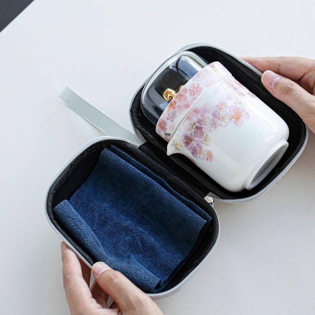 White Porcelain Floral Travel Tea Set: Includes One Pot, Three Cups, and Portable Bag.