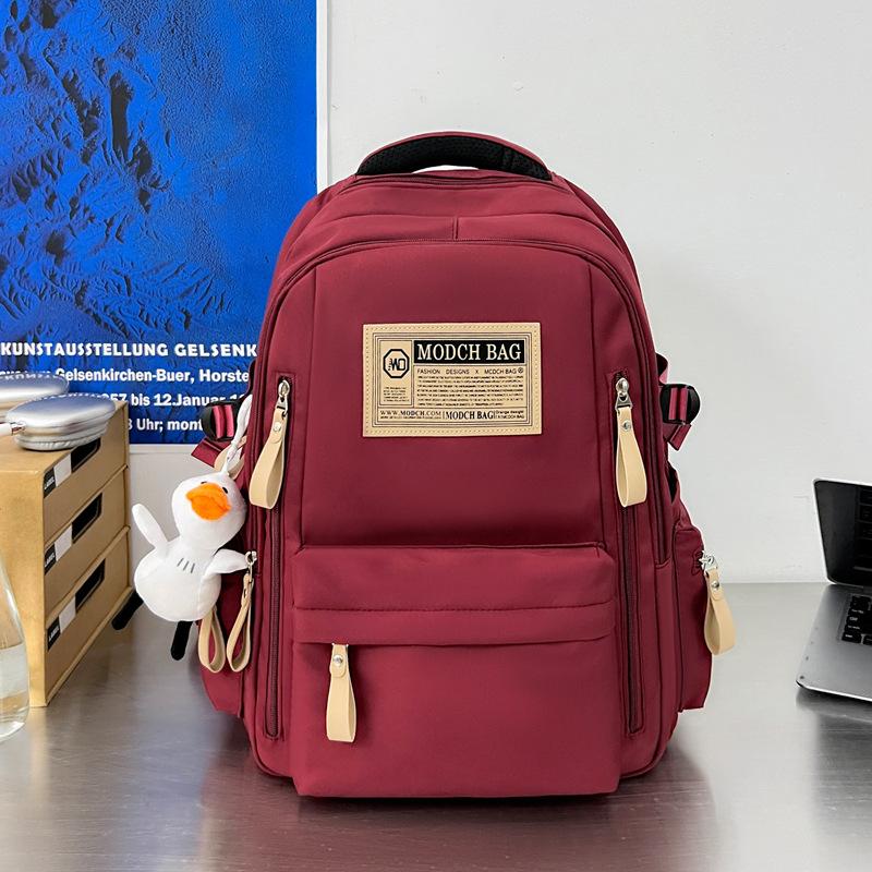 Schoolbag is specially designed for new schoolbags, female students, nylon retro simple, junior high school students, male large-capacity couple .