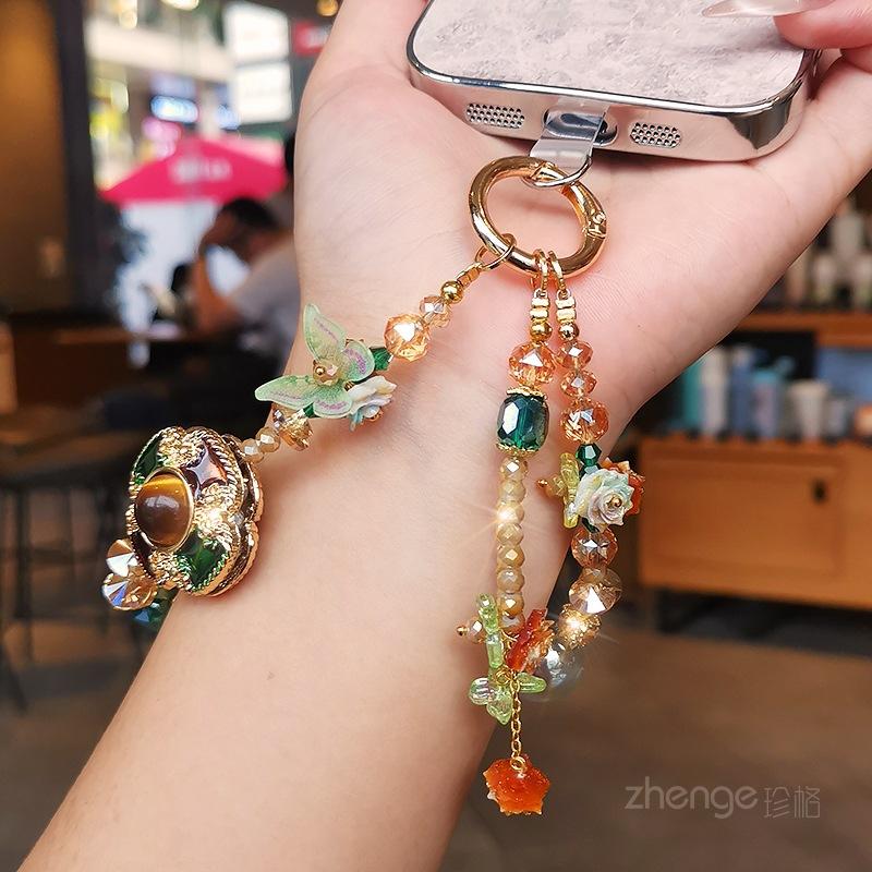 Light luxury mobile phone chain pendant women's high-value boutique handmade beaded wrist rope short outdoor travel