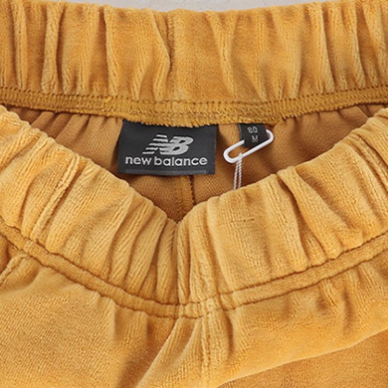 New Balance Универсальные спортивные штаны Color Block Nbml934053 30 Желтый
