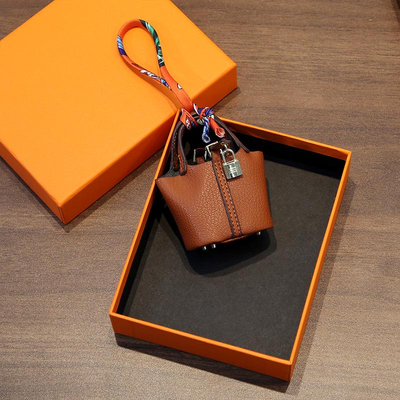 Стильный кожаный брелок и аксессуар для сумки для наушников - Милая и креативная женская модная подвеска