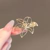 High-End Brooch Women'S Metal Hollow Lily Niche Design Advanced Sense Anti-Light Brooch Pin Buckle Light Luxury