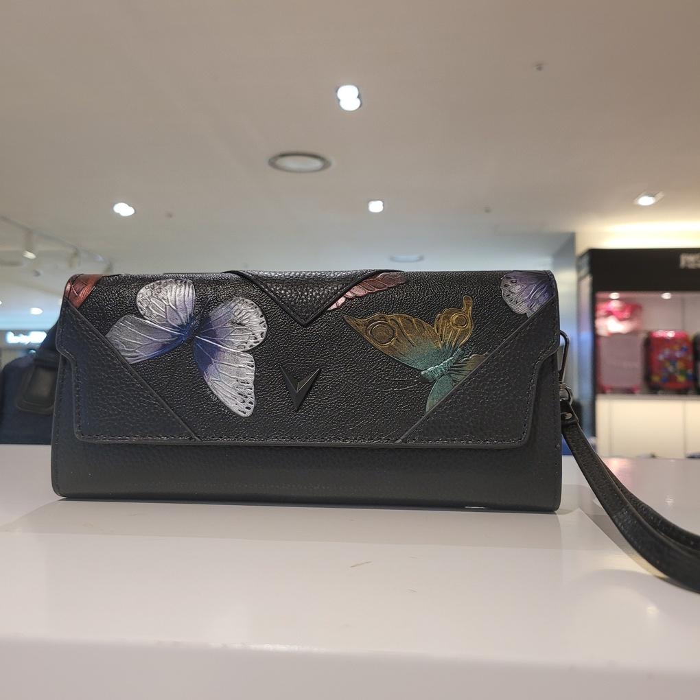 Mari Eclaire's favorite luxury mini clutch bag made of natural cowhide leather with ample storage space.