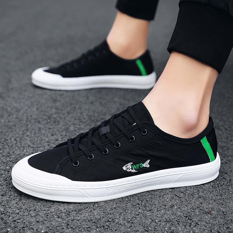 Four Seasons Men's White Canvas Shoes: Korean Style, Casual, Breathable, Lace-up, Low-top Fashion Sneakers.