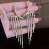2 изогнутые женские серьги-подвески, элегантные длинные серьги с кисточками из стразов, великолепный циркон, подарок на свидание