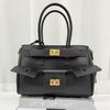 2025 New High Quality Neutral Hot Girl Motorcycle Bag Fashion Versatile Commuter Women's Bag Lock Tote Wing Bag
