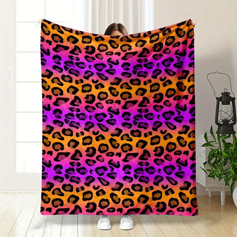 Black leopard spots on a gradient background of orange, pink, and purple. for all seasons blanket lunch break throw gift