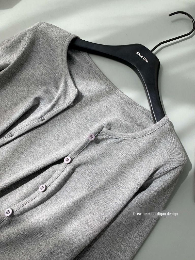 White Moonlight Women's Three-Piece Set: High-Waist Skirt, Cardigan, and All-Match Gray Suspenders for Spring and Autumn.