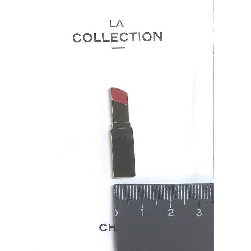 Used Chanel cosmetic pin badge
