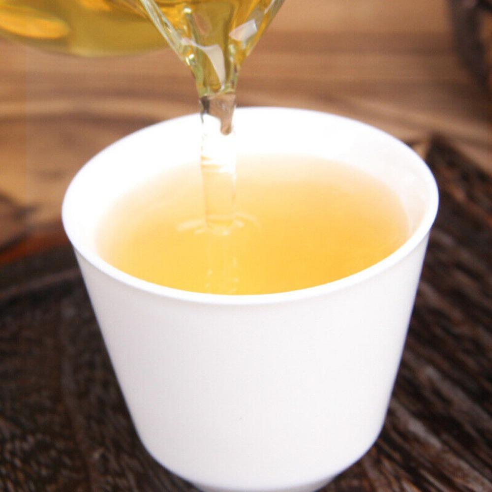 100 г чая пуэр с древнего дерева Цзинмай - ароматизированный пирог с орхидеей горы Мин