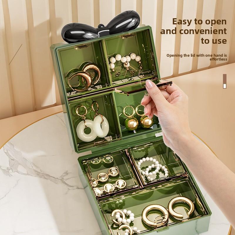Small portable travel jewelry box, exquisite new model for storing earrings, necklaces, rings, and other accessories with compartments