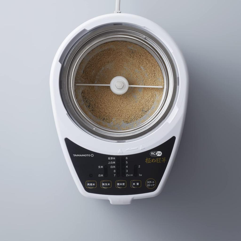 Электрическая домашняя шлифовальная машина для риса Yamamoto Ultimate Germ White разделяет рис на белую крупу и отруби, а модель YE-RC21A-WH шлифует рис и зародыши.