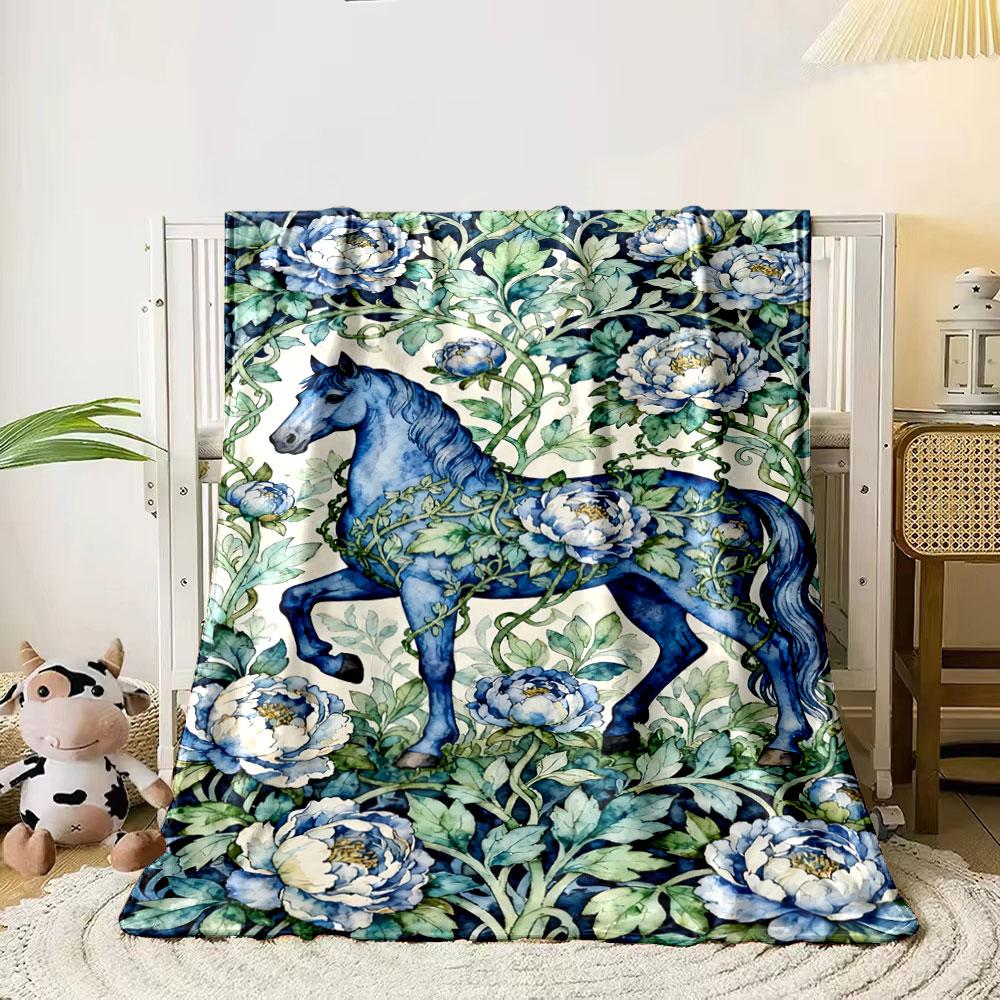 A blue horse entwined with vines and surrounded by blue peonies. for all seasons blanket lunch break throw gift