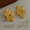 Artistic sense Handmade hammer pattern flower stud earrings Hollow petals French retro high sense literary atmosphere Versatile earrings