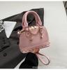 2025 New Niche Design High-end Champagne Rivet Portable Shell Bag Women's Fashionable Foreign Style Shoulder Messenger Bag