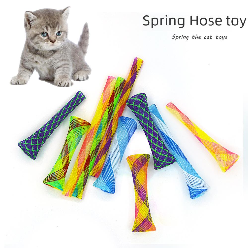 Новые трансграничные комиксы: Товары для домашних животных, игрушки для кошек, жевательные игрушки для стачивания когтей, телескопические эластичные игрушки и разноцветные пружинные трубки.