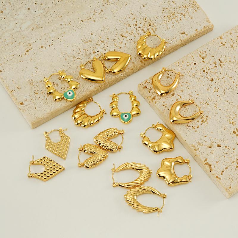 Cross-border European and American high-end stainless steel plating18K Gold vintage design hollow green eye earrings