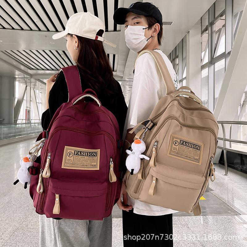 Schoolbag student schoolbag junior high school campus large capacity backpack wholesale simple multi-layer leisure travel computer bag