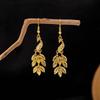 Богемные серьги с кисточками в виде листьев: Этнический дизайн с павлином и золотыми колокольчиками