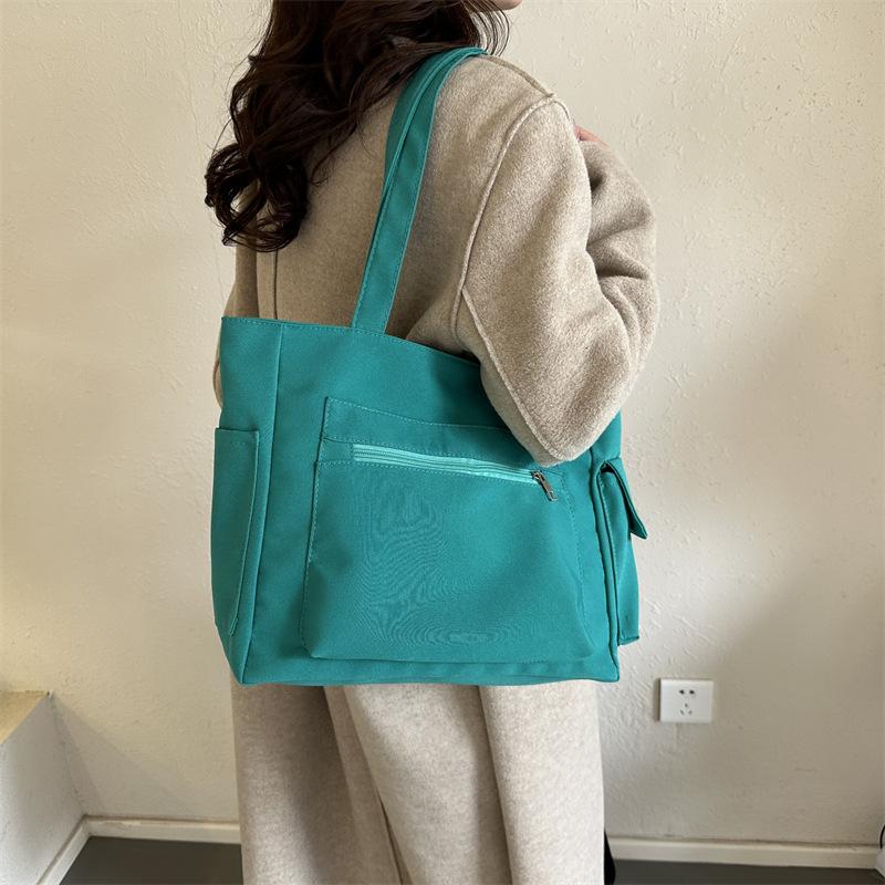 Корейская версия нишевого дизайна простая холщовая однотонная сумка женская сумка 2024 зимняя новая сумка большой вместимости через плечо подмышку